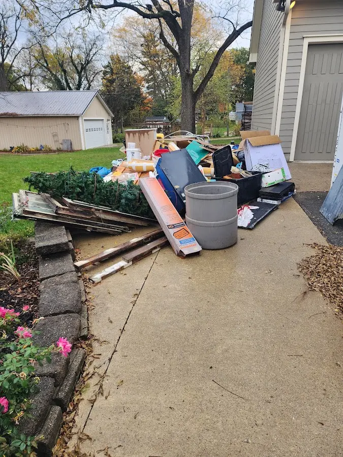 Dumpster being loaded with debris for 30 Yard Dumpster Rental in Grapevine